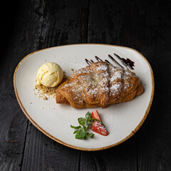 delicious croissant with chocolate and ice cream