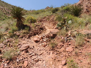 Red rocks in mountain path