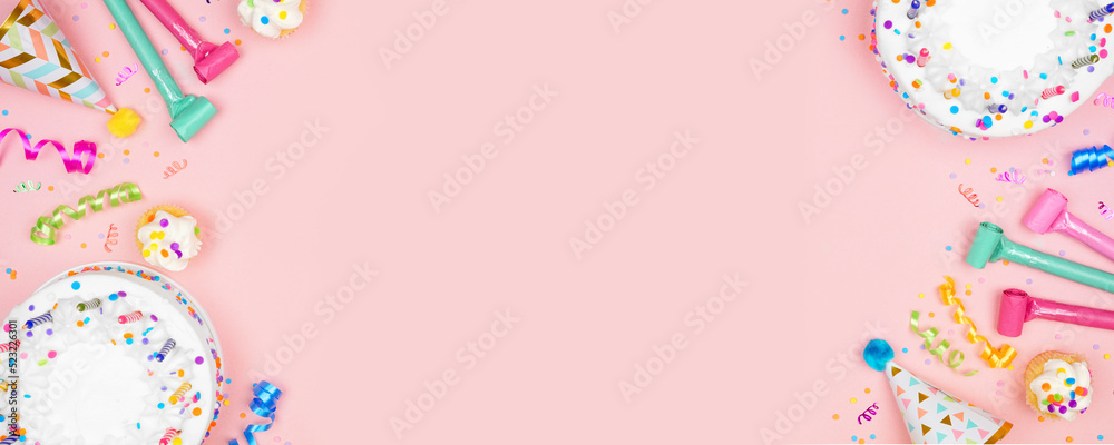 Poster birthday party double border on a soft pink banner background. top down view with cakes, party hats 