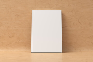 Blank vertical hardcover book cover mockup standing on wooden background