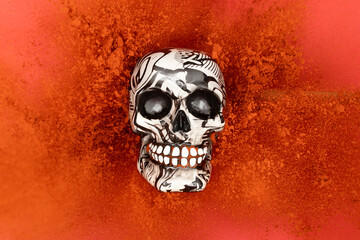 Halloween skull with red powder explosion. Minimal scary holiday concept. Creative creepy composition.