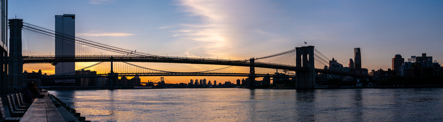 Panoramic Silloutte of the Brooklyng Bridge In the Early Morning hours from Pier With Clear Skies