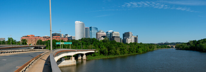 Arlington, Virgina - June 4, 2022: View of Downtown Arlington and Potomac River from the Theodore Roosevelt Bridge - obrazy, fototapety, plakaty