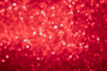 background of red glitter in defocusing
