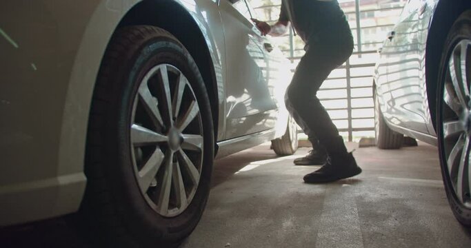 Thief stealing a car