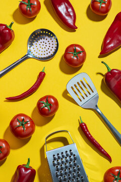 Background with vegetables and kitchen tools on a yellow table. Ingredients. Food preparation.