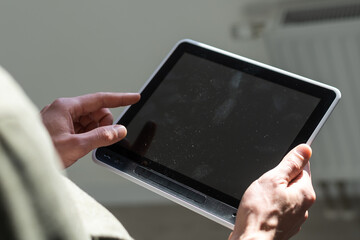 man holding digital tablet, closeup