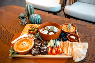 Tray with traditional arabic breakfast on a wooden table