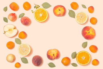Trendy summer background - tropical fruits on a pink background