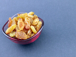   a bowl of yellow golden raisins        
