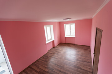 light pink color wall with modern lamp and empty concept and frame.
