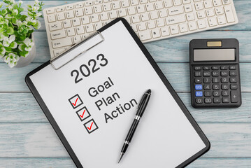 Clip board with text and number 2023, goal, plan, action