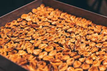 The process of home cooking dried fruits in an electric dryer.