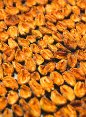 The process of home cooking dried fruits in an electric dryer.