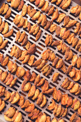 The process of home cooking dried fruits in an electric dryer.
