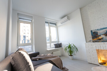 Modern minimalistic dark gray loft style studio apartment interior design. kitchen, sitting area, workplace