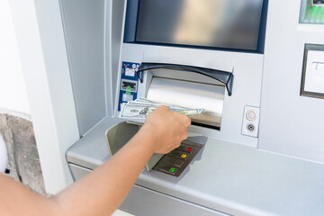 Atm money cash machine. Woman withdraw money bill. Holding american hundred dollar cash. Bank credit card, us dollar.