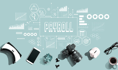 Payroll theme with electronic gadgets and office supplies - flat lay