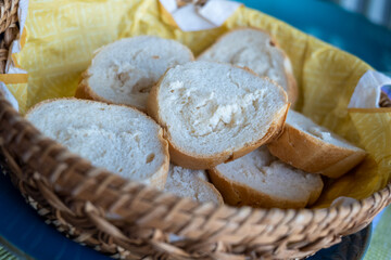 sliced white bread in a wooden basket