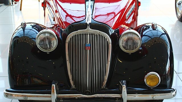 Front view of french veteran family car Simca 8 manufactured in year 1947, red and black colour. Displayed on small veteran expo in Nitra, Slovakia.