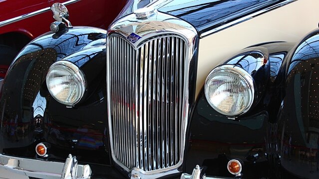 Front mask of veteran British executive car Riley RM from year 1950, displayed on small veteran expo. Right front view.