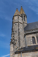 Fototapeta na wymiar Collegiate Church Saint-Aubin at Psalette square in medieval town of Guerande. Current architecture of Saint-Aubin Church dates from XV - XVI century. Guerande, Loire-Atlantique, Western France.