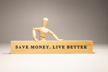 Save money, life better written on wooden surface. Motivation and personal development.