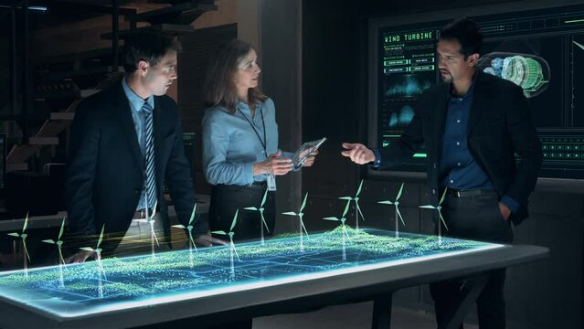 Professional Engineers and Specialists Working on Renewable Clean Energy Innovative Project Analyzing the Efficiency of Wind Turbines using Futuristic Holographic AR Technology. Cinematic 4K.