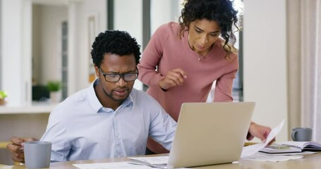 Stressed couple on laptop looking at debt finance paper work, trouble paying insurance loans or online ebanking together at home. Serious, unhappy man and woman anxious about bills, tax and mortgage - Powered by Adobe