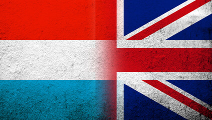 Fototapeta premium National flag of United Kingdom (Great Britain) Union Jack with Luxembourg National flag. Grunge background