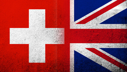 National flag of United Kingdom (Great Britain) Union Jack with National flag of Switzerland. Grunge background