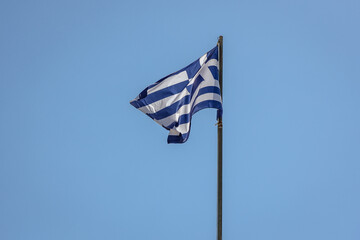 Greek flag in Old Venetian Fortress in Corfu town on Corfu Island, Greece