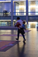 man playing with his children inside CCK Buenos Aires, Argentina