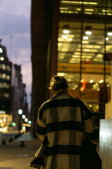 cinematic photo of a woman walking down the street Buenos Aires, Argentina