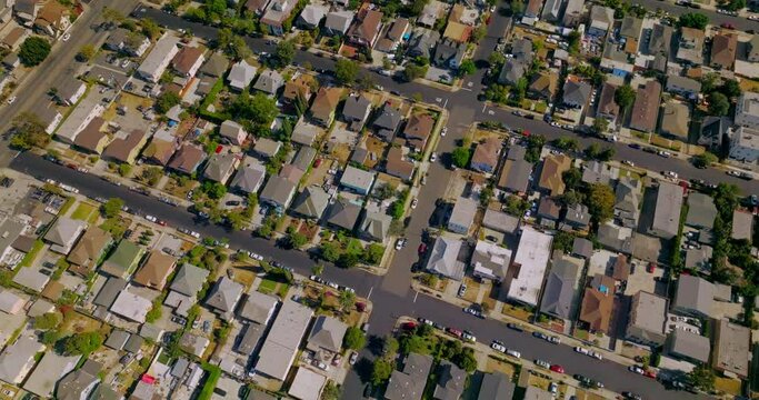 Scenery of residential district in Los Angeles, California, USA. Flying over the roofs of private houses on sunny day. Aerial view.