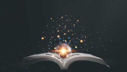 Glowing light bulb on a book, Inspiring from read concept, Educational knowledge and business...