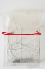 grungy, dusty, old plastic box with red rope string