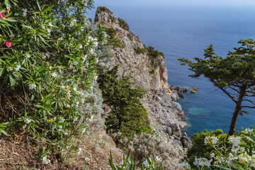Fototapeta na wymiar Rocks over Ionian Sea, view from hilltop in Palaiokastritsa village, Corfu Island, Greece