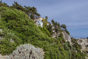 Fototapeta na wymiar Monastery in Palaiokastritsa village, Corfu Island, Greece, view from viewing point