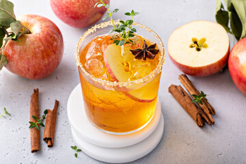 Apple cider margarita with brown sugar rim and fresh thyme