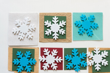 foam snowflakes on paper tiles