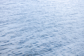 small waves on the water, blue tint of water on a sunny day
