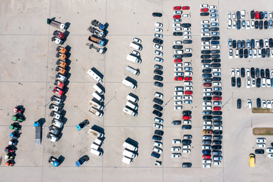 Aerial view of a parking lot with cars