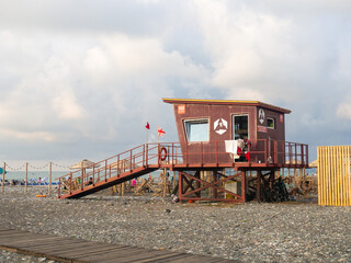 Lifeguard booth on the beach. Rescue post at sea. Protection. Wooden building on the beach.