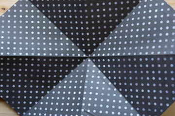 folded paper with dot pattern