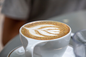 Flower pattern on a cafe latte at a restaurant 