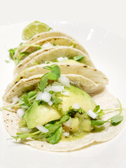 Fish tacos with avocado and onion