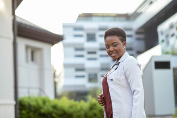 Fototapeta premium African American medical doctor posing to the camera and smiling