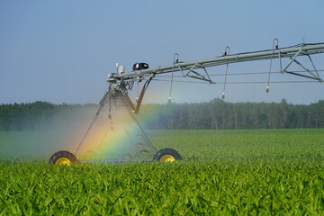 Farm irrigation system creates rainbows from the sun.