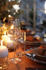 Fototapeta na wymiar Elegant table setting with beautiful decor and burning candles indoors